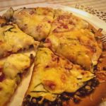 Vegetarische Magionipizza met courgette en mozzarella